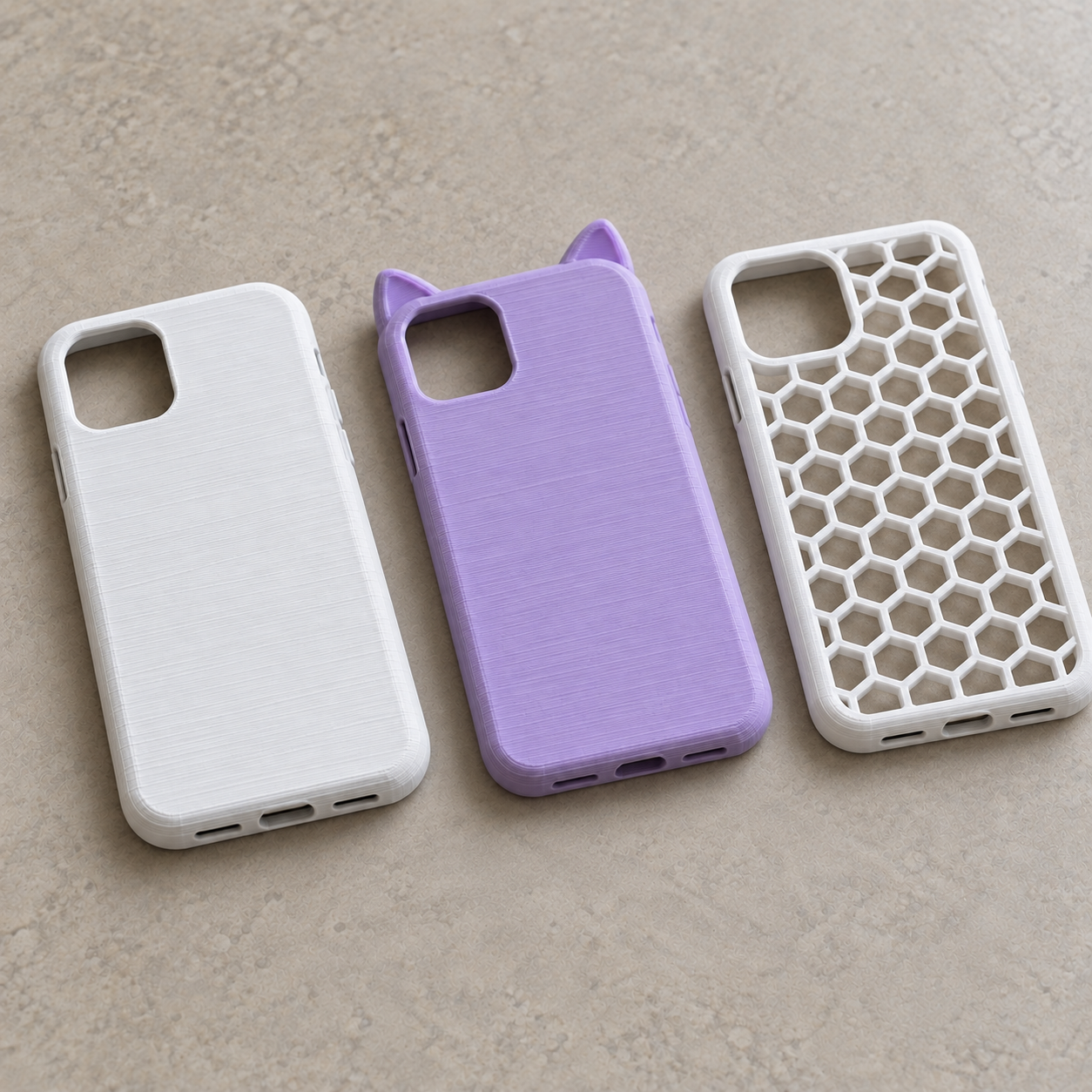 Example 3D printed phone cases: plain white, purple cat-ear and white honeycomb skeleton design